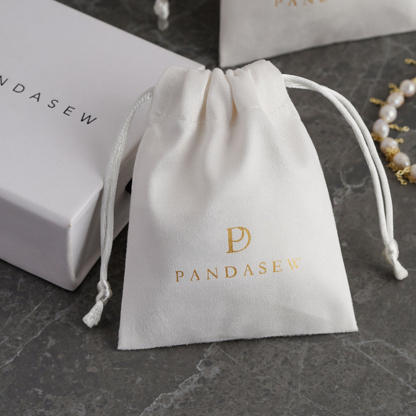 grey color flannel bag with debossed logo, jewelry packaging small business