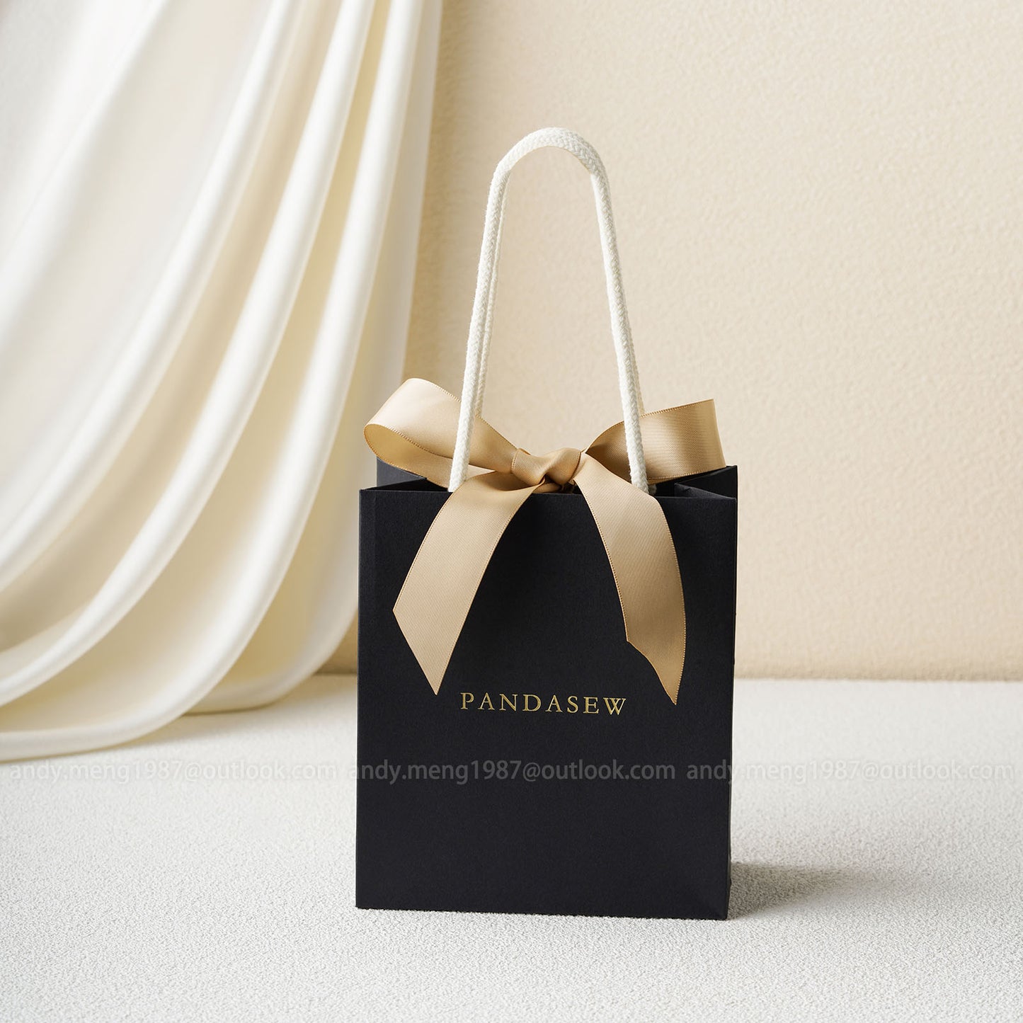 black paper bags with brown handles