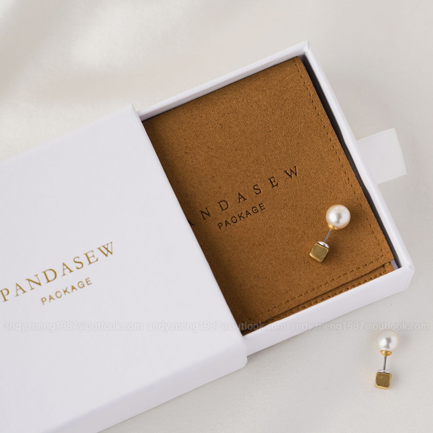 brown pouches with box set. Both with debossed strong logo