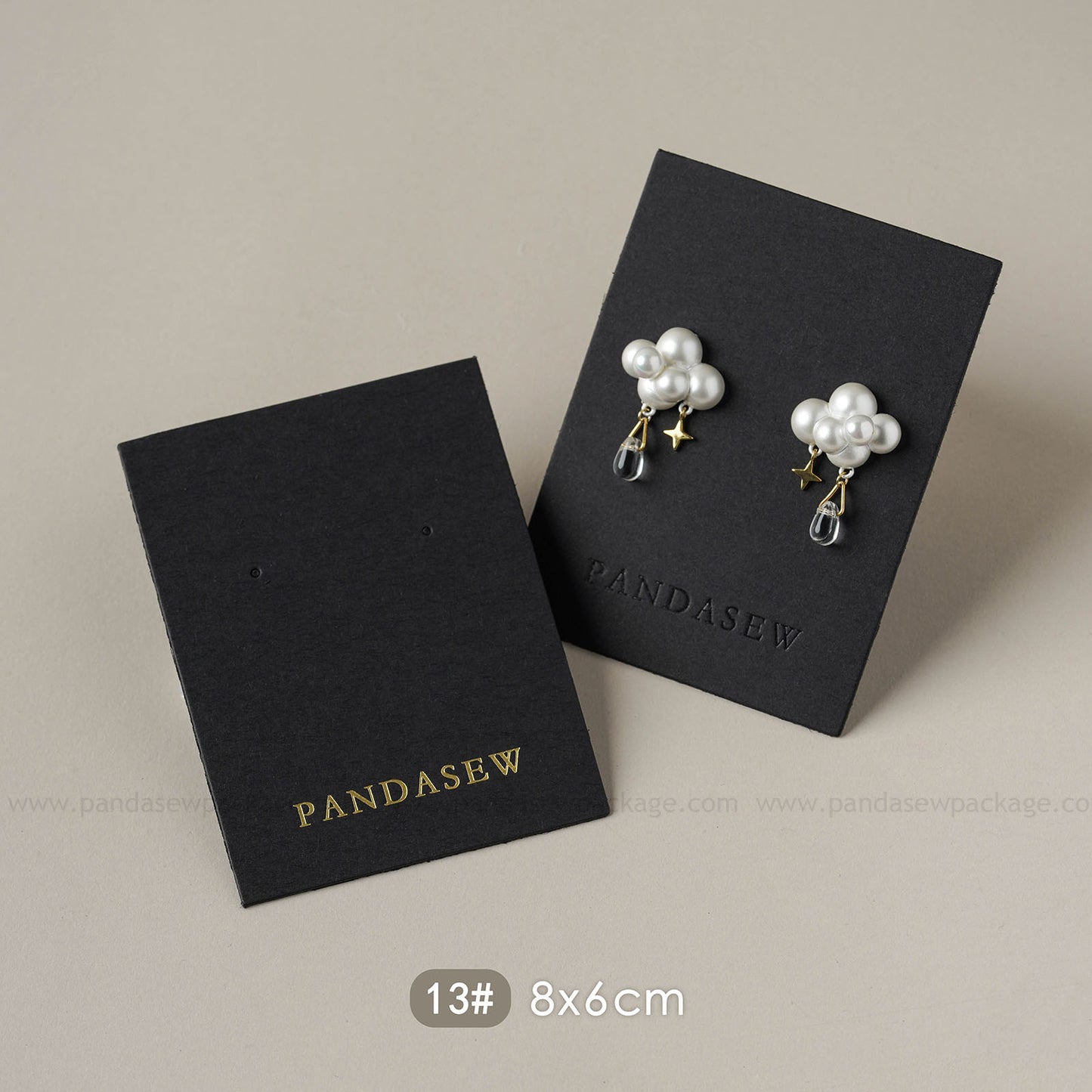 black earring cards deboss gold logo