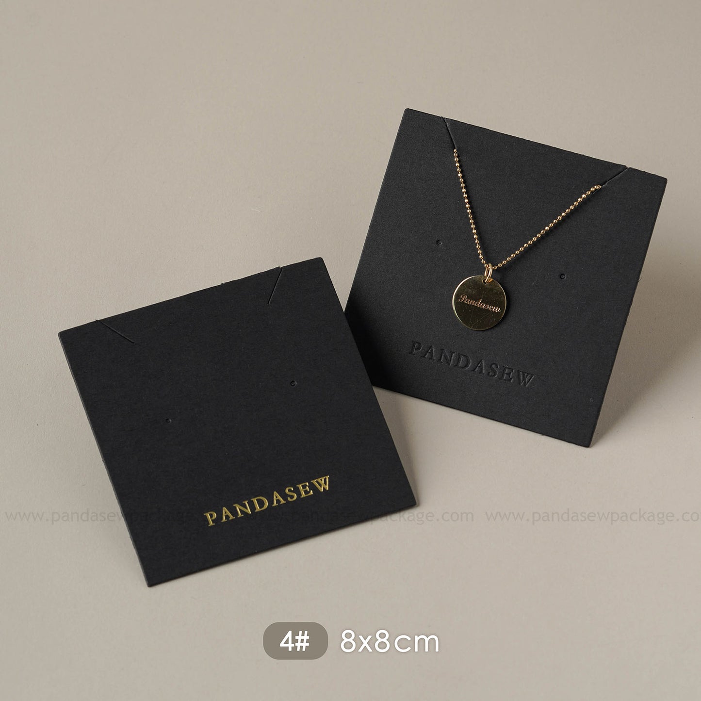 black earring and necklace cards deboss gold logo