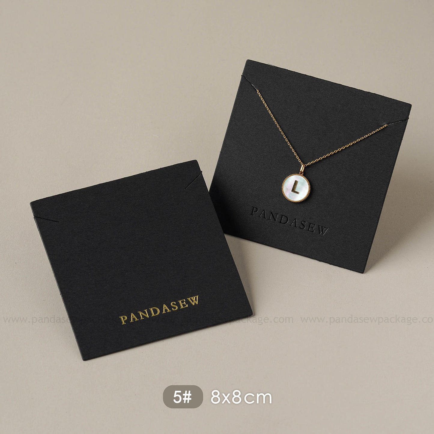 black earring and necklace cards deboss gold logo