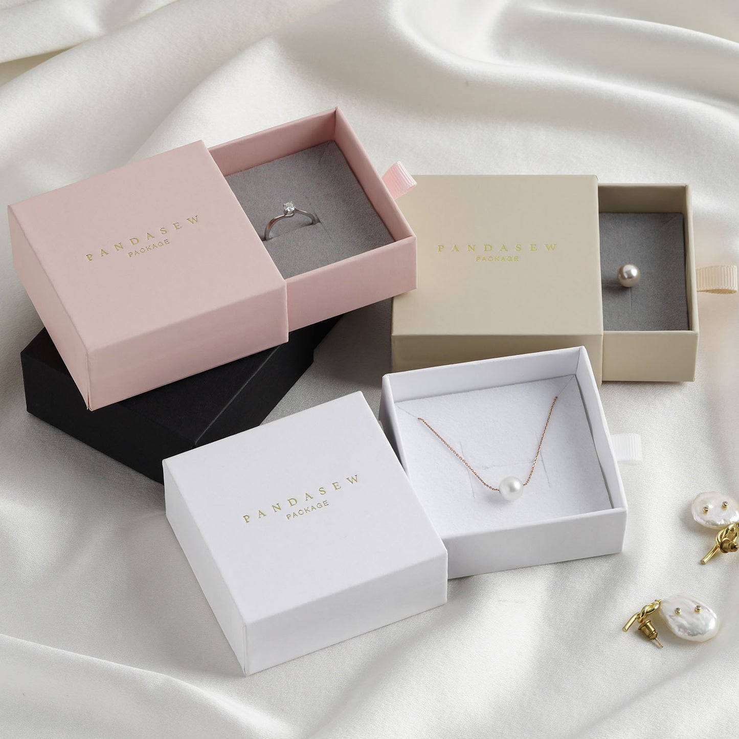 ring and necklace jewelry boxes in white, black, wheat and pink.