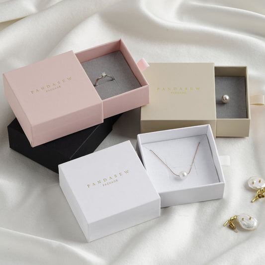 ring and necklace jewelry boxes in white, black, wheat and pink.