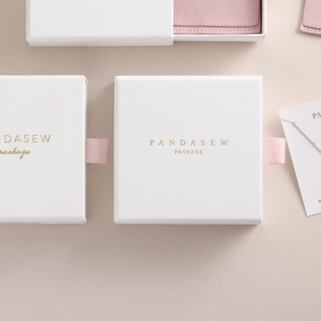 white jewelry gift box with pink pull