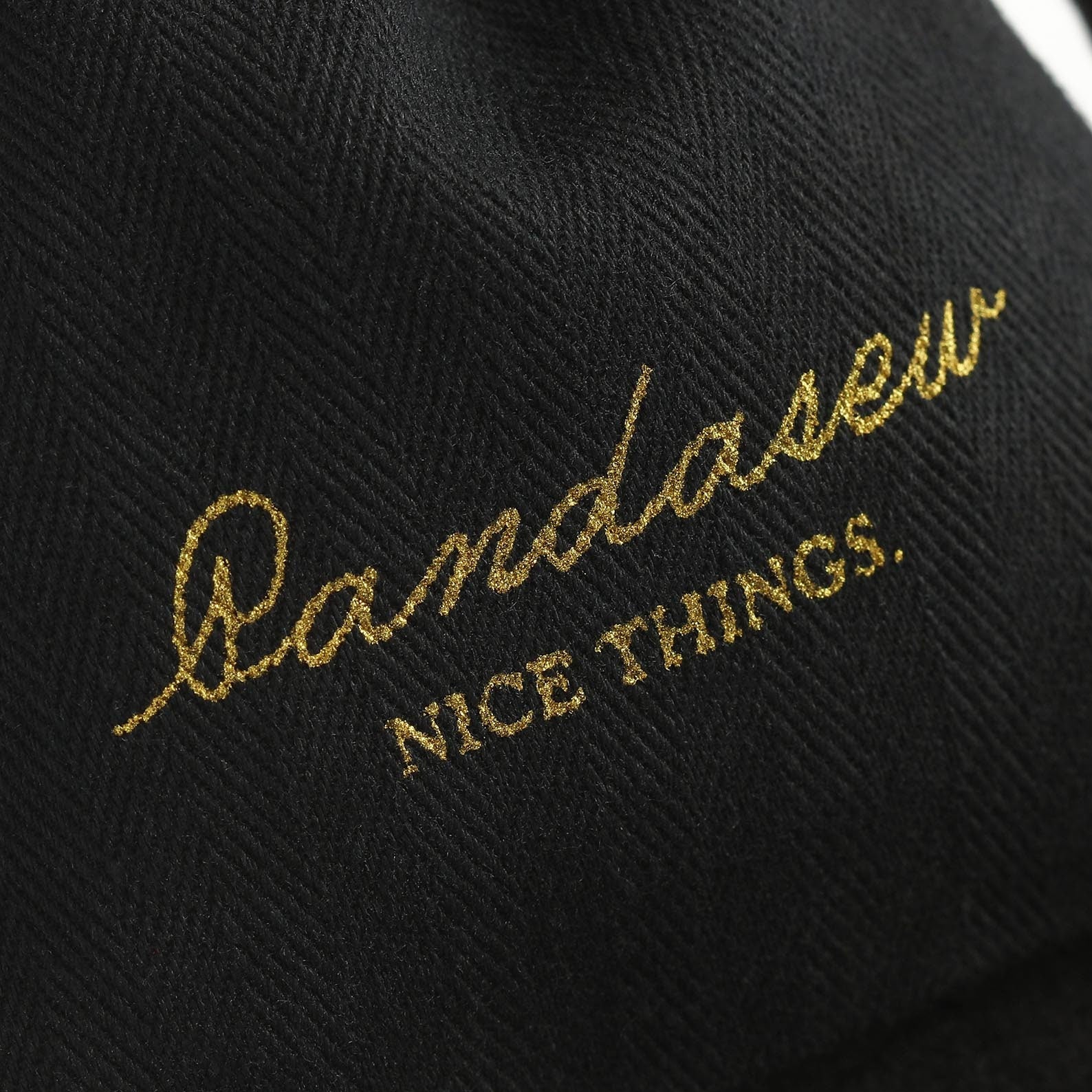 Silkscreen gold logo on cotton bag