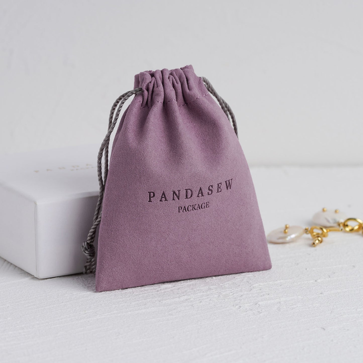 purple necklace and ring bag