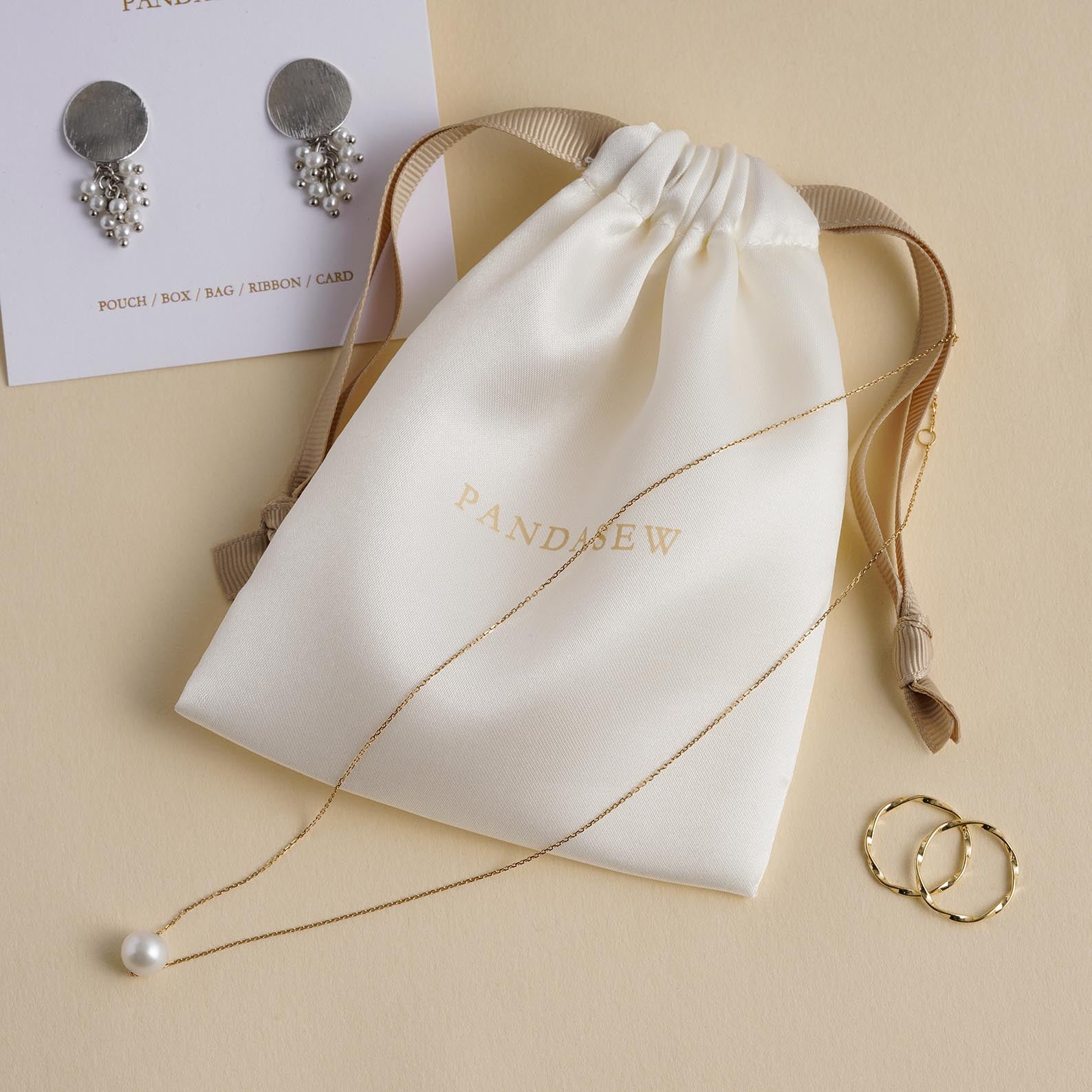 cream white color satin bag with khaki grosgrain ribbon, pantone printing logo, jewelry bag