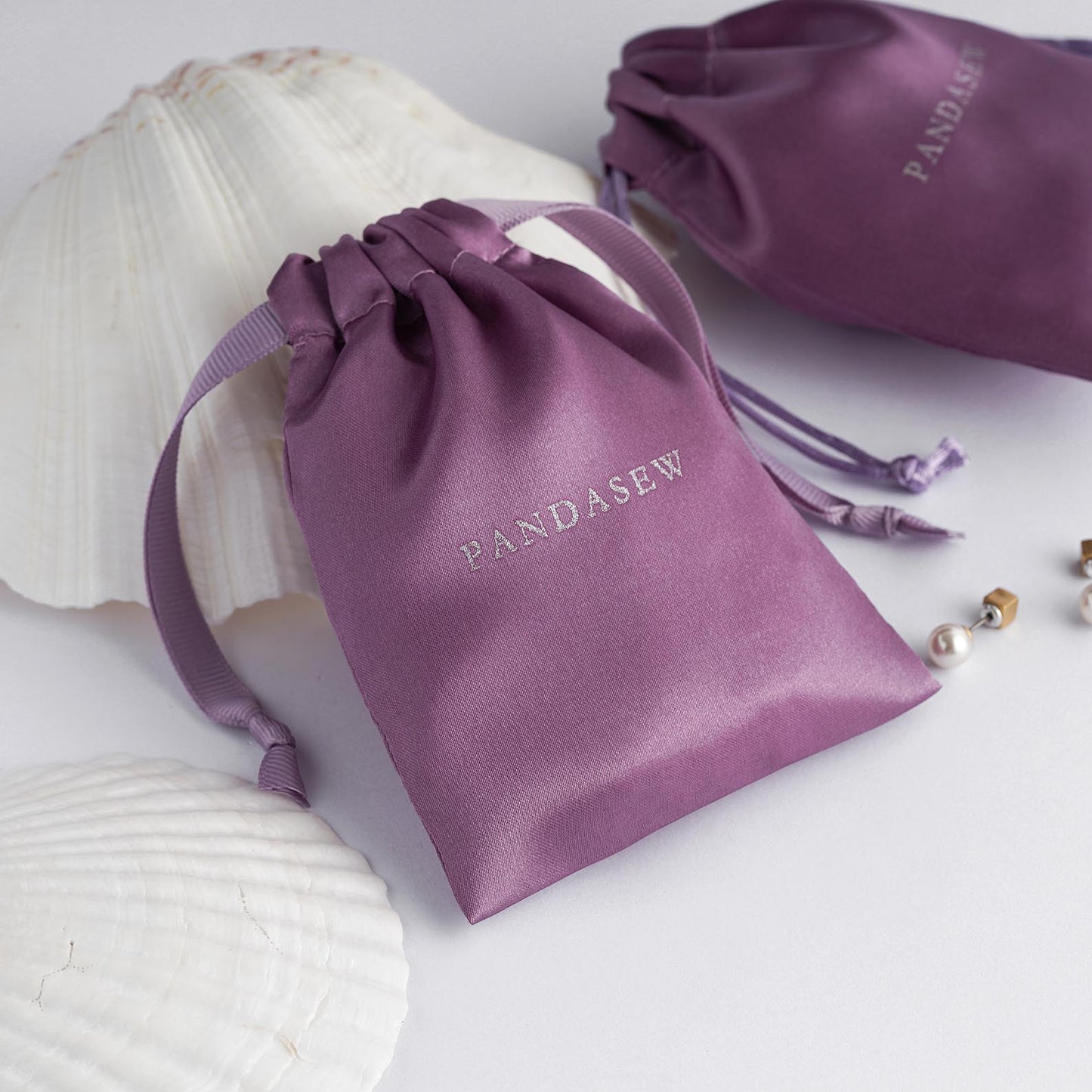 purple satin bag with branded logo, bulk product package supply, candles, soap packaging