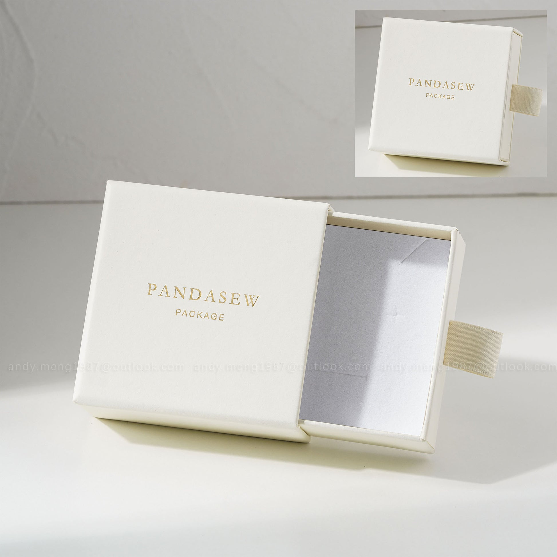 Cream jewelry box with custom gold logo