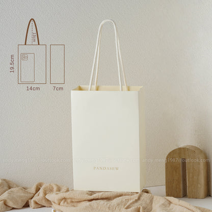 cream white paper bags with cotton handles