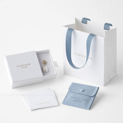 small white paper bag with white box and blue button bag