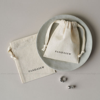 PANDASIEW Handmade jewelry presented in stylish, reusable cotton bags. Perfect for jewelry lovers, gift pack
