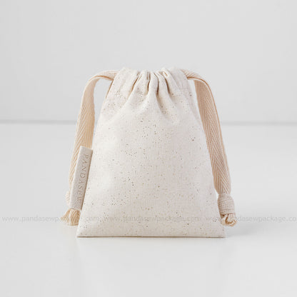 beige cotton drawstring bag with label printing