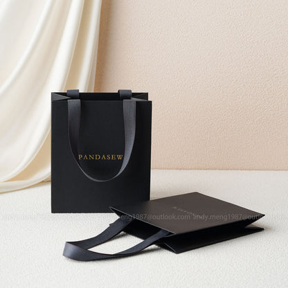 black paper bags with handles