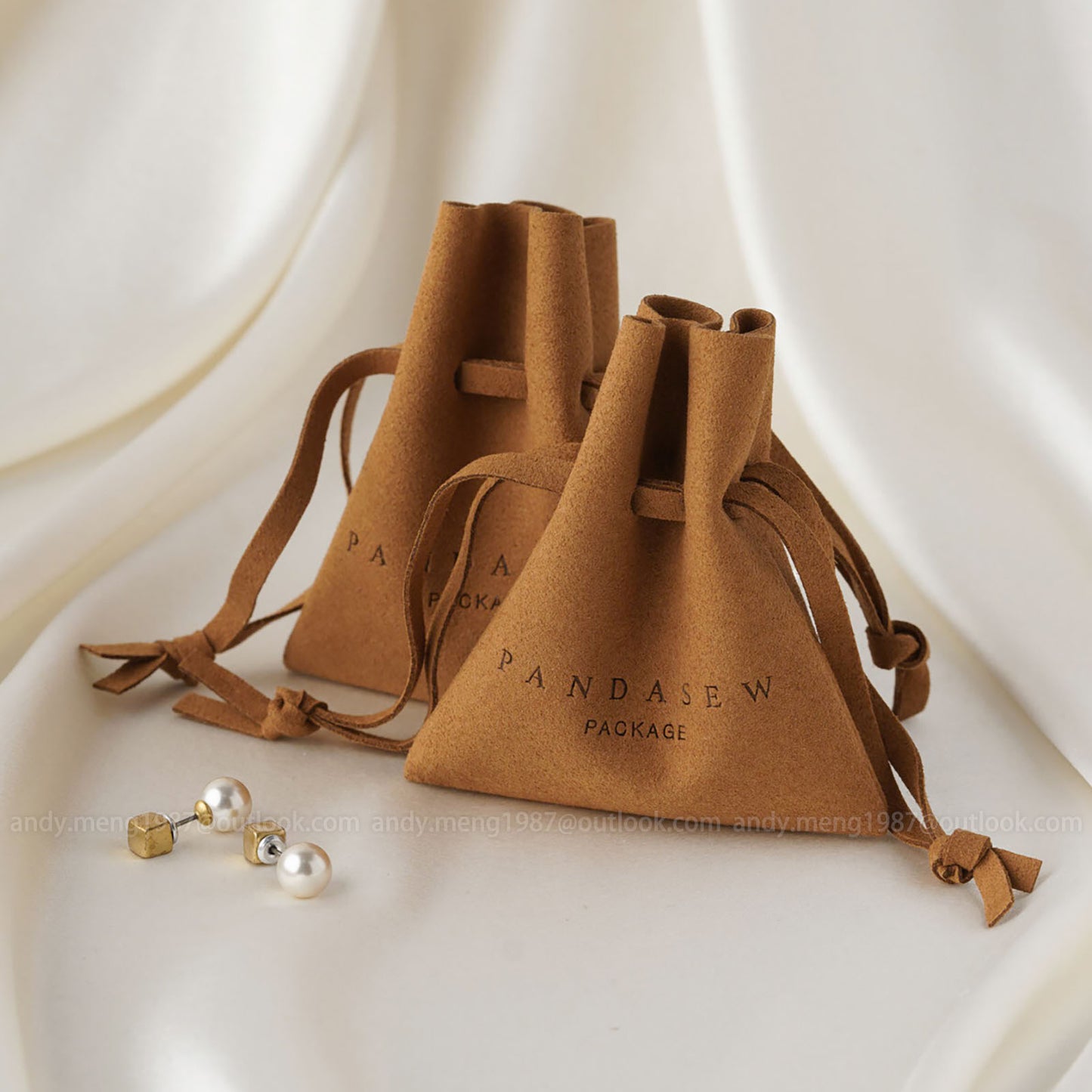 Brown drawstring pouch with colorless embossed logo that won't get off