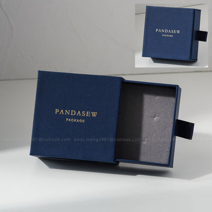 Navy blue jewelry box with custom gold logo