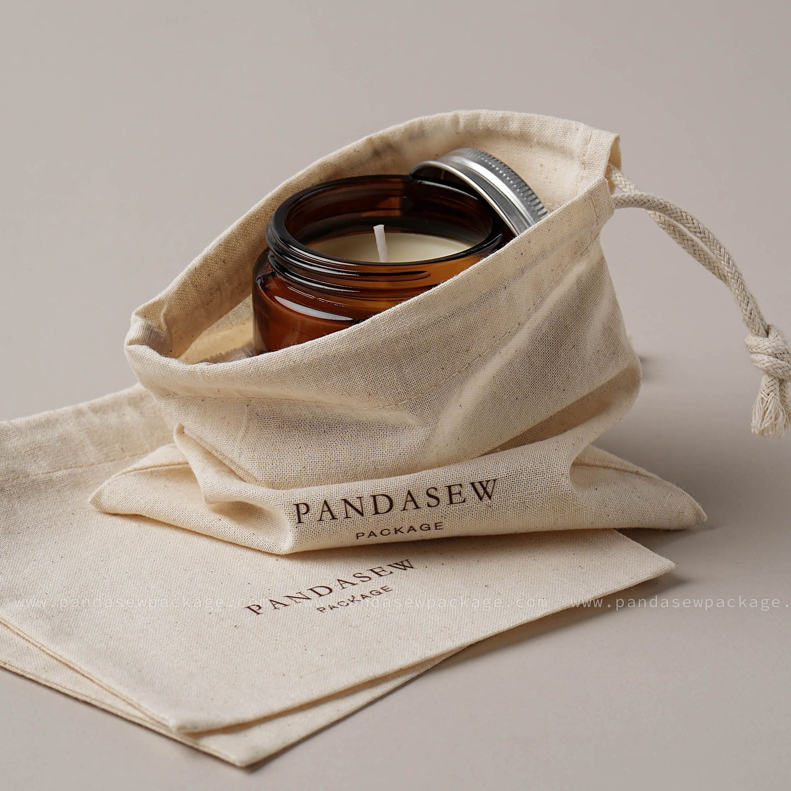 beige cotton bag for perfume, candles and presents