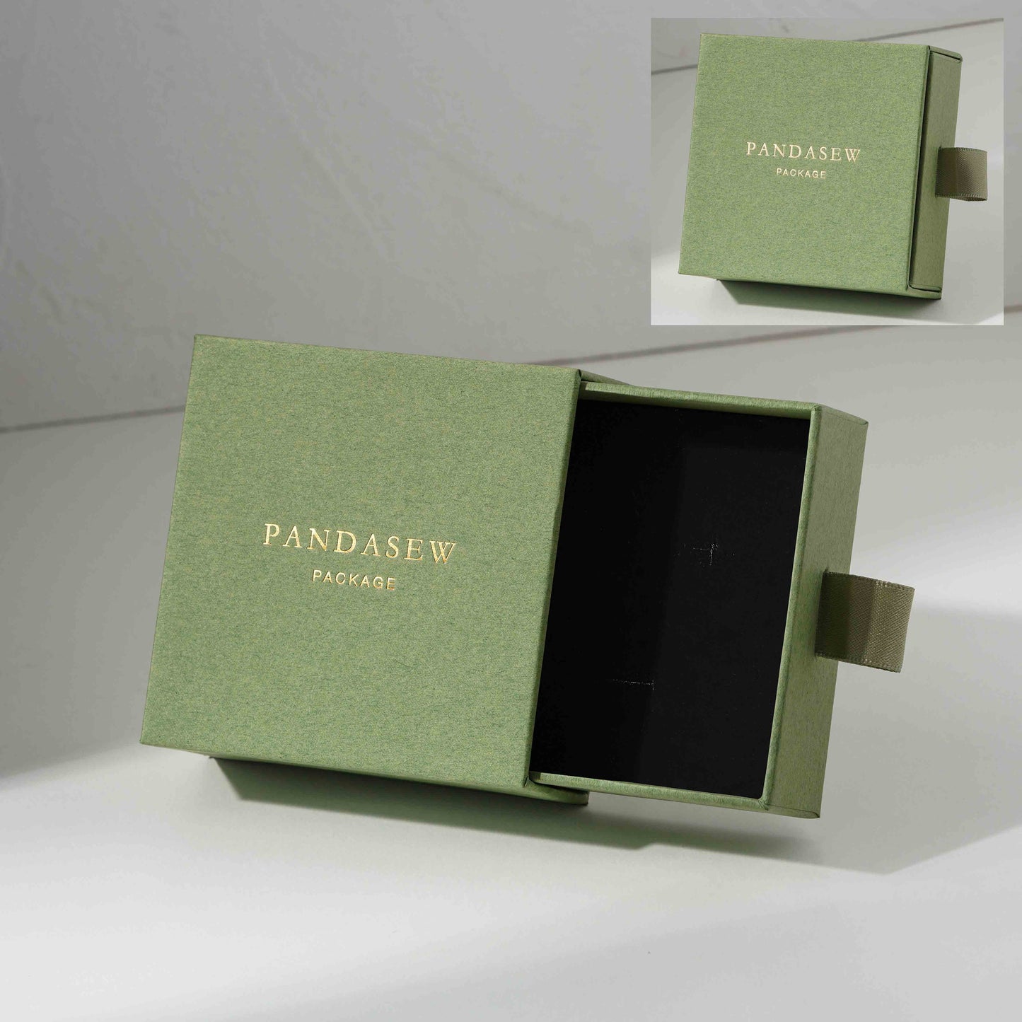 green jewelry box with custom gold logo