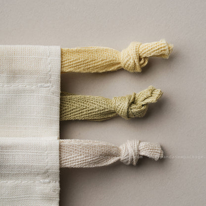 Close-up detail of thick 5mm cotton drawstring ropes. Durable and high-quality cord construction for jewelry bags.