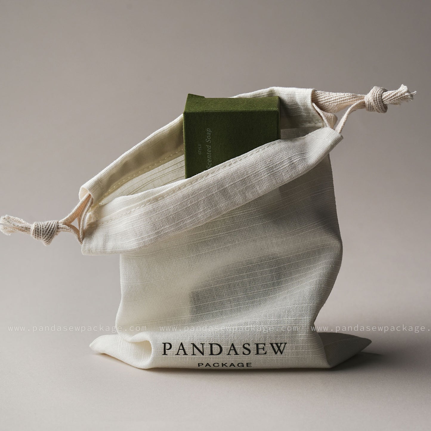 Versatile drawstring pouch holding a soap bar or card. Ideal custom packaging for wedding favors and gifts