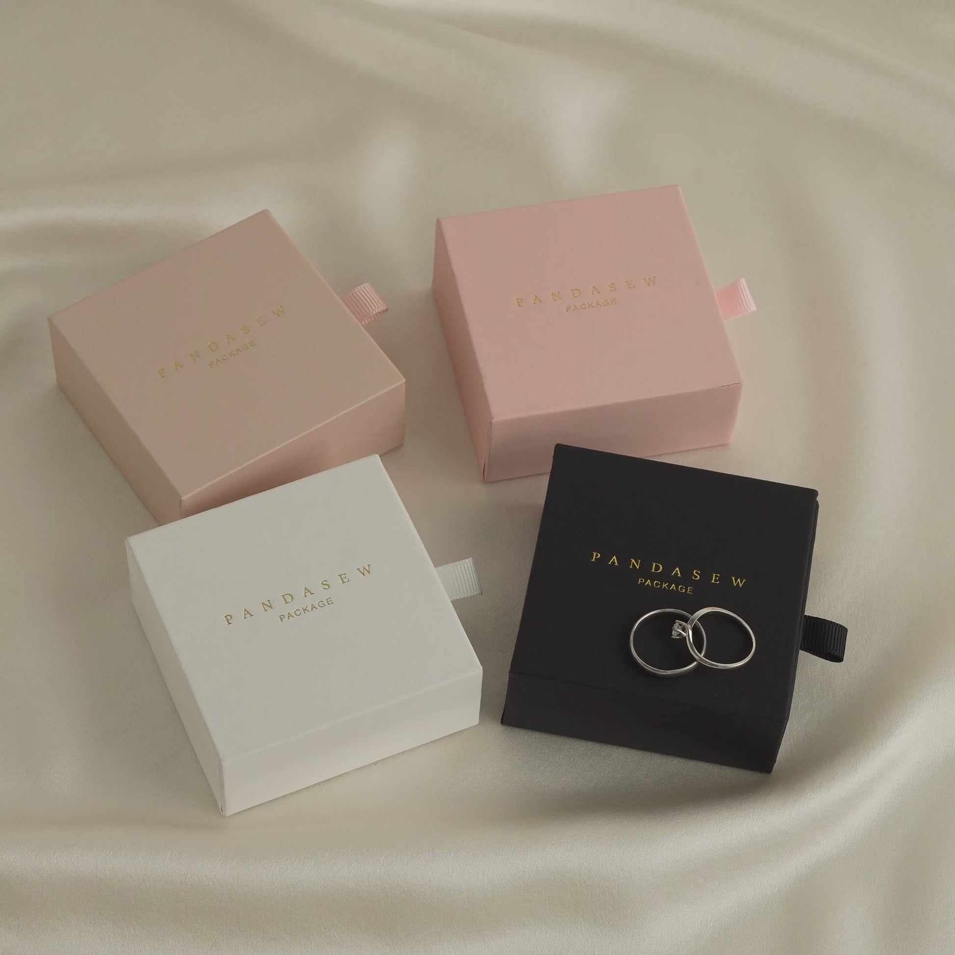 ring and necklace jewelry boxes in white, black, wheat and pink.