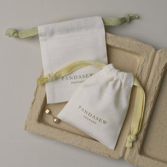 Video demonstrating the soft texture and high-quality material of custom printed cotton linen jewelry pouches