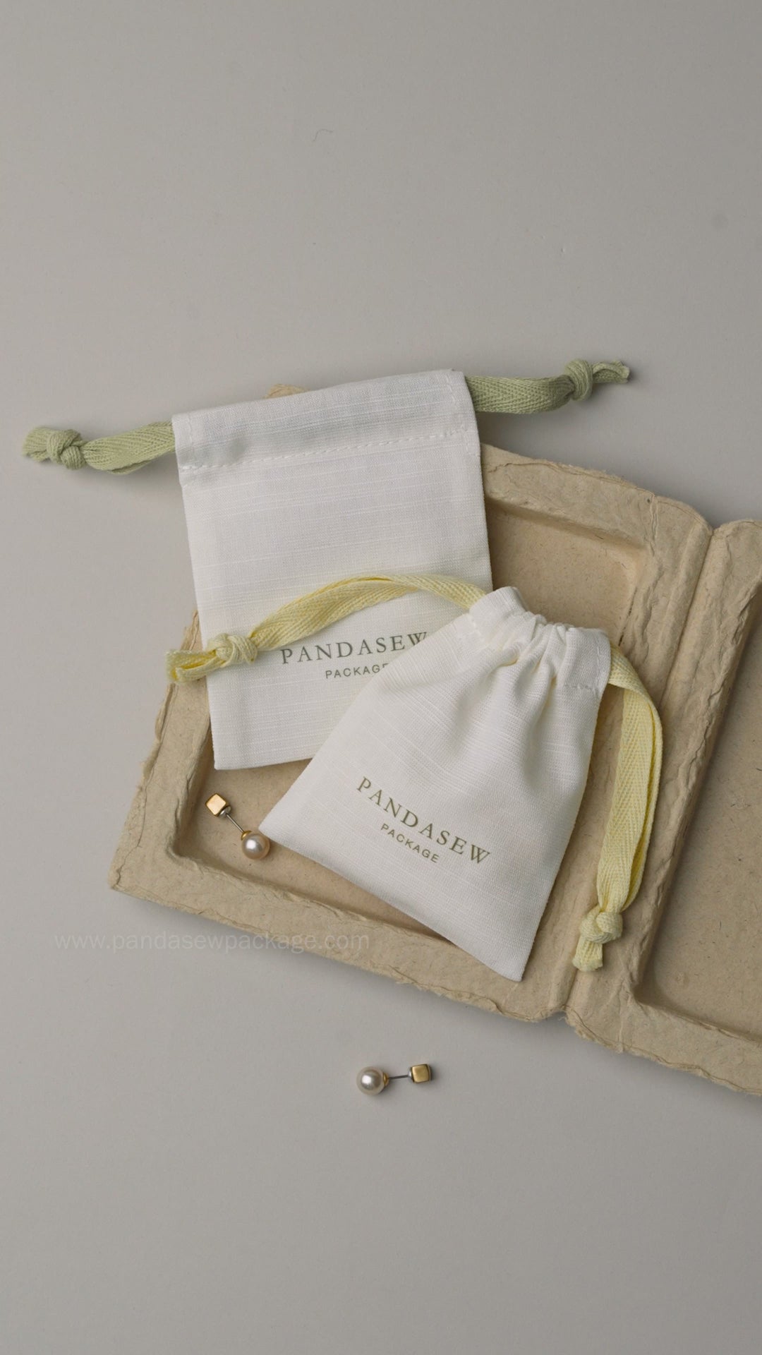 Video demonstrating the soft texture and high-quality material of custom printed cotton linen jewelry pouches