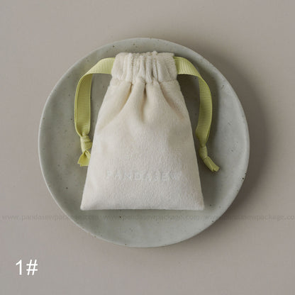 White velvet drawstring Pandasew bag. Aromatherapy/jewelry storage with custom logo