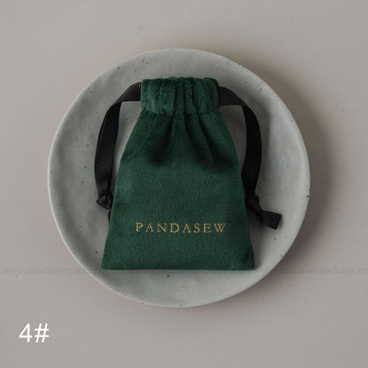 Dark green velvet drawstring Pandasew bag. Aromatherapy/jewelry storage with custom logo