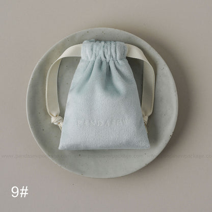 Blue velvet drawstring Pandasew bag. Aromatherapy/jewelry storage with custom logo