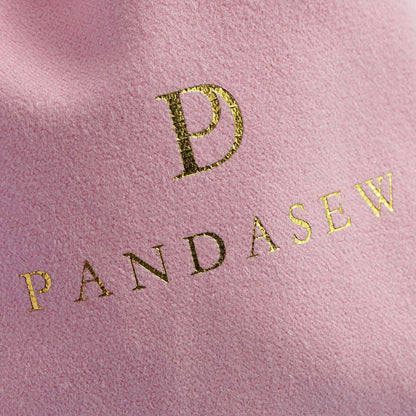pink velvet pouch with gold foiled logo