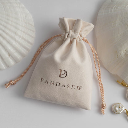 PANDASEW Elegant beige drawstring gift pouch branded 