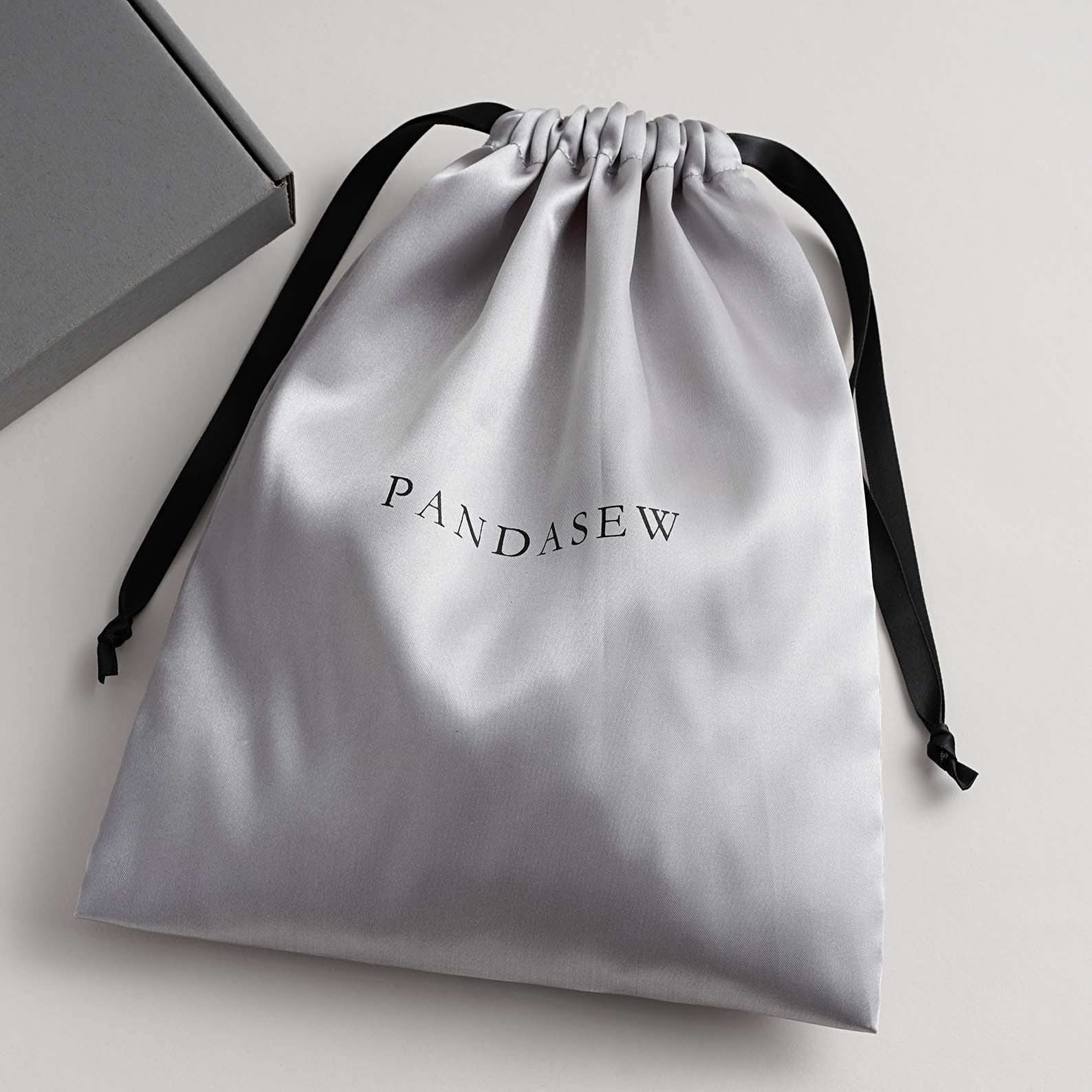 Gray satin bag with personalized logo. It is glossy. Logo is silkscreen.