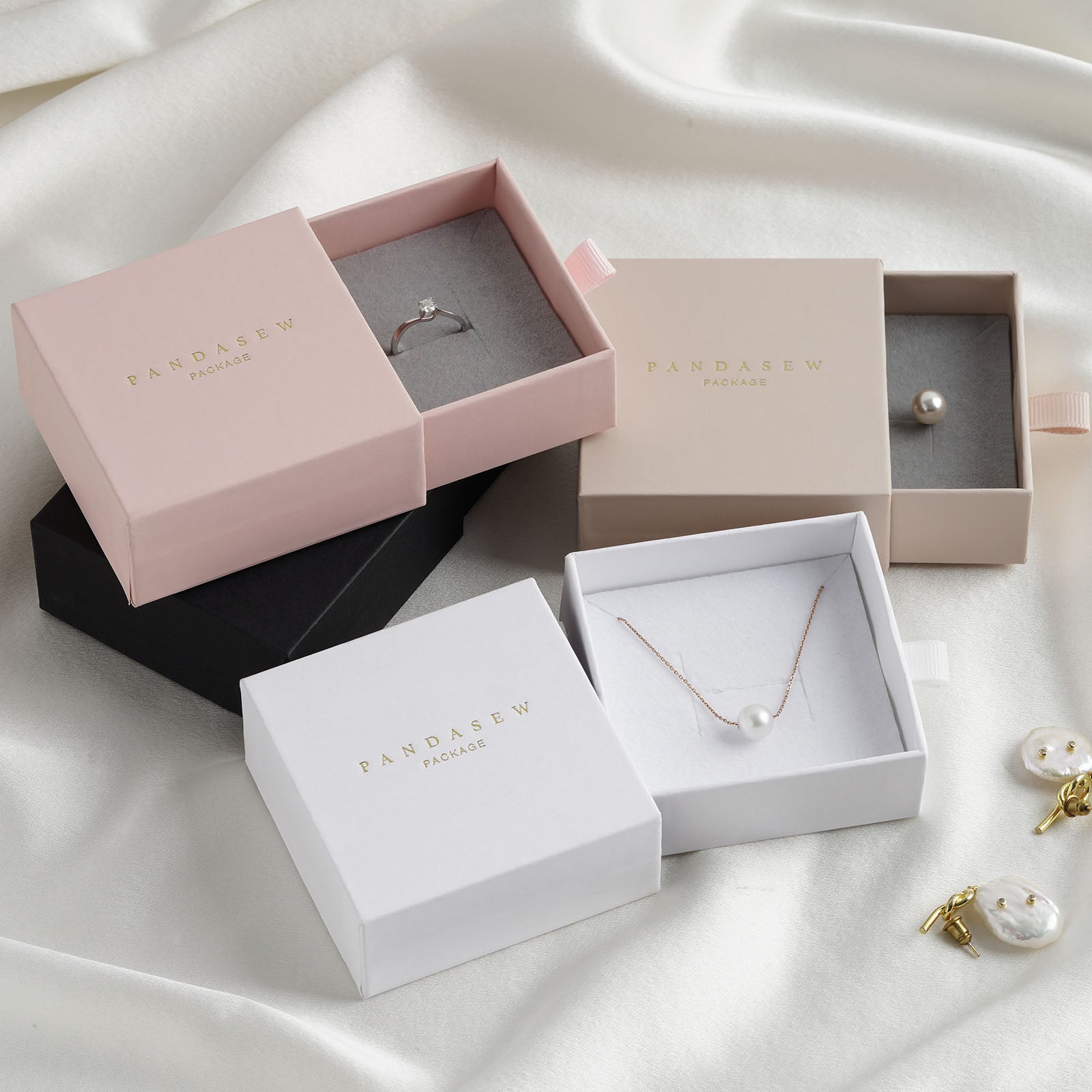 ring and necklace jewelry boxes in white, black, wheat and pink.