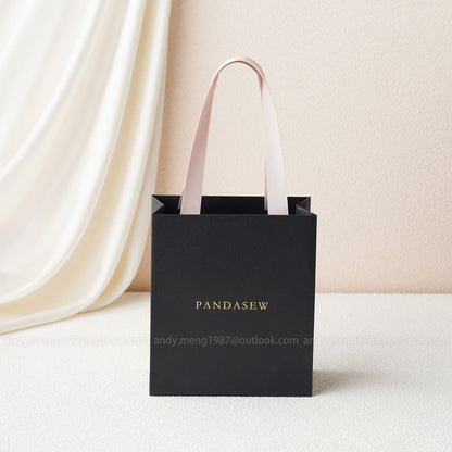 black paper bags with handles