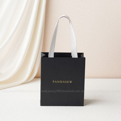 black paper bags with handles