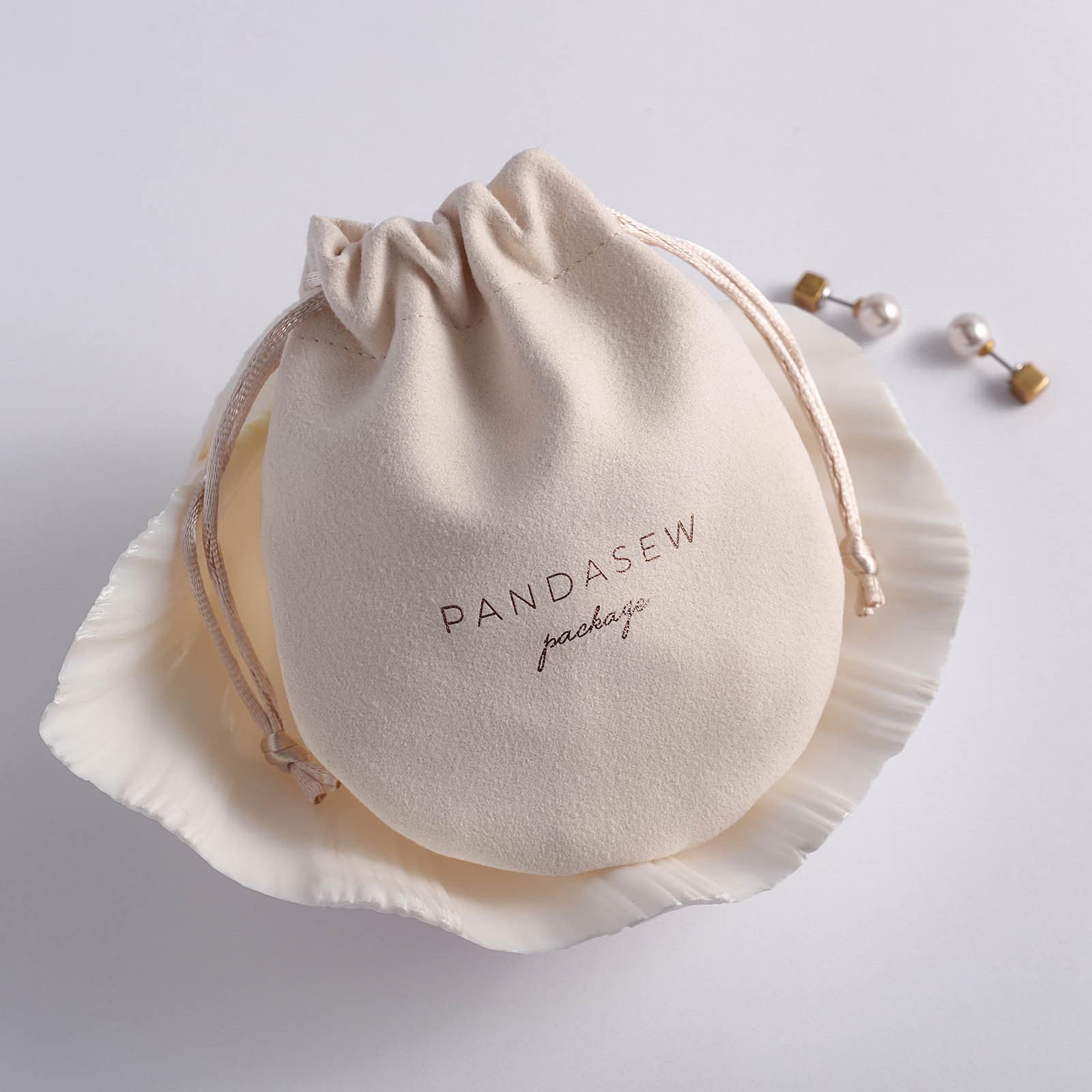 velvet jewerly bag beige color velvet bag with rose gold foiled logo