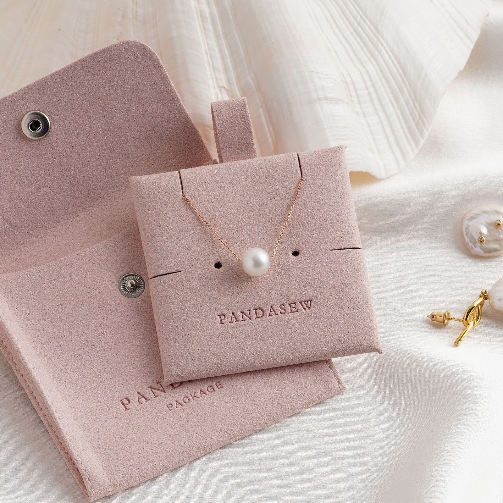 Button bag and necklace pad set, necklace package