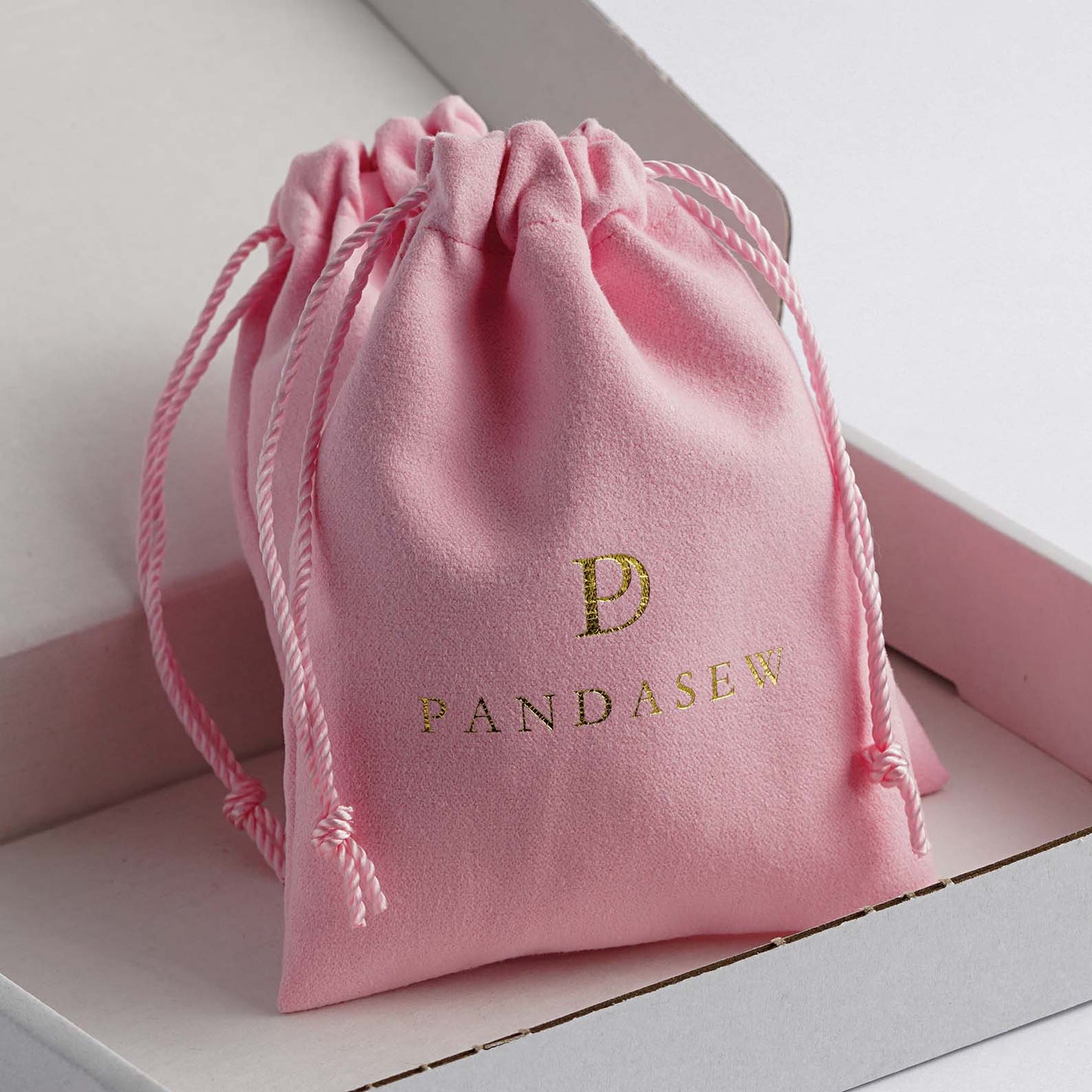 bright pink velvet pouch with customized paper box