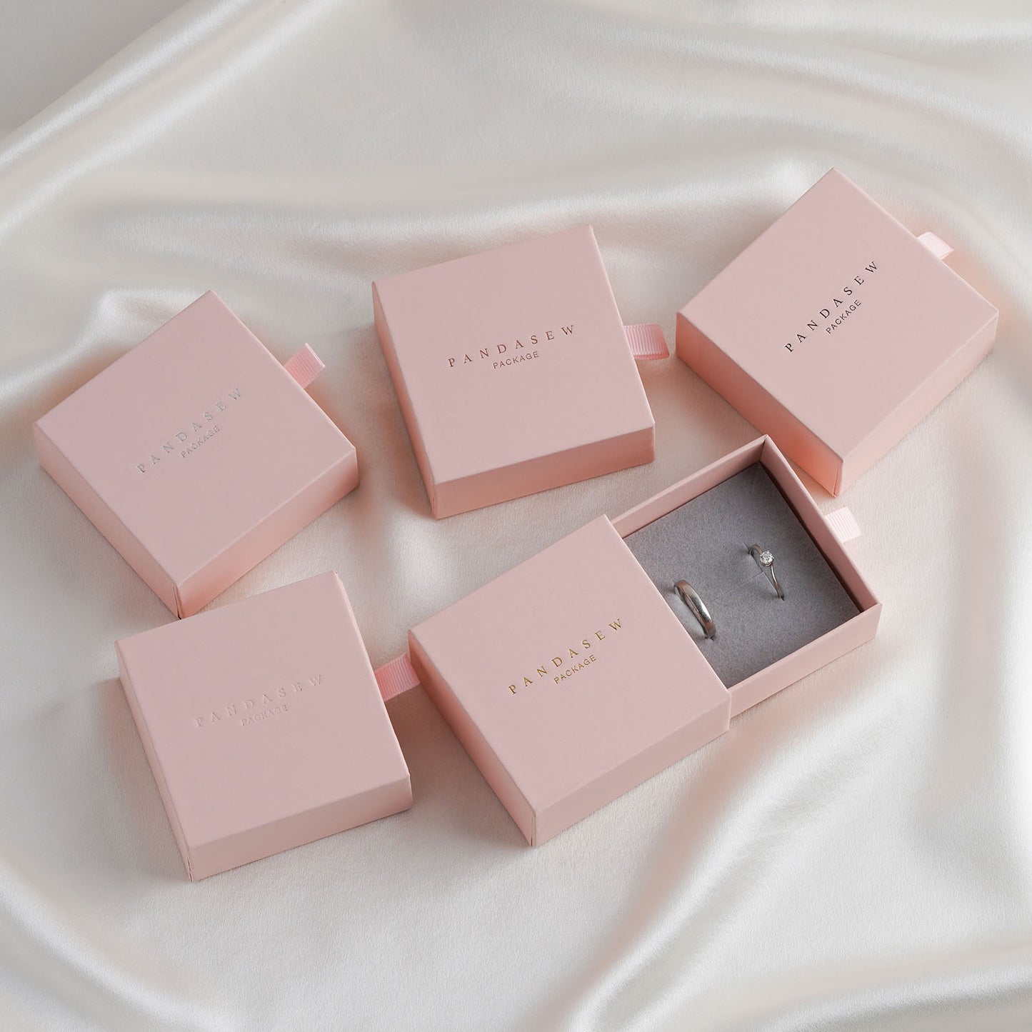 Pink cardboard jewelry ring boxes